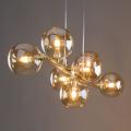 Złota lampa wisząca ze szklanymi kloszami kulkami w kolorze bursztynowym 7*G9 ESTERA GOLD 5668 TK Lighting